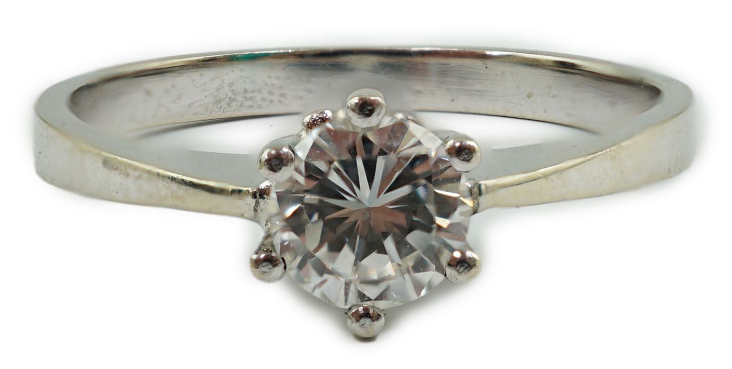 A modern 14k gold and solitaire diamond set ring